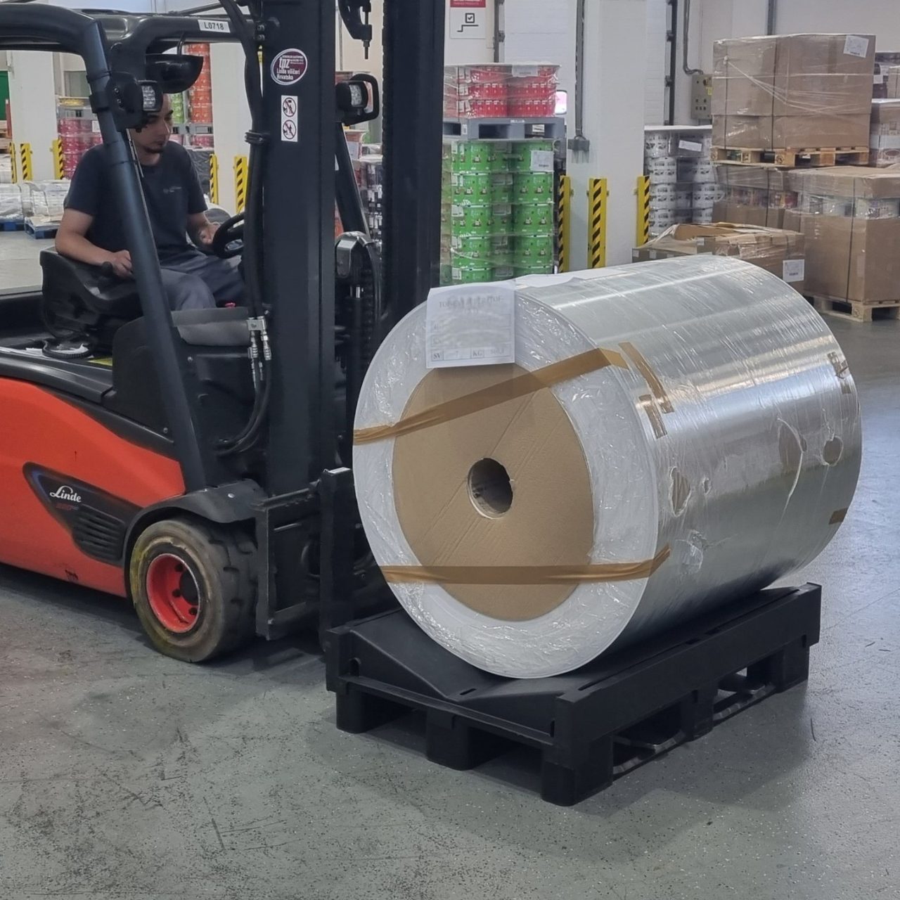 Reels on roll pallets in a rack